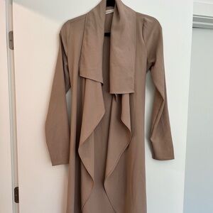 Women’s flowy beige jacket with belt